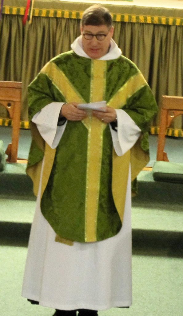 Canon Allan Maclean, Rector, welcomes the congregation.